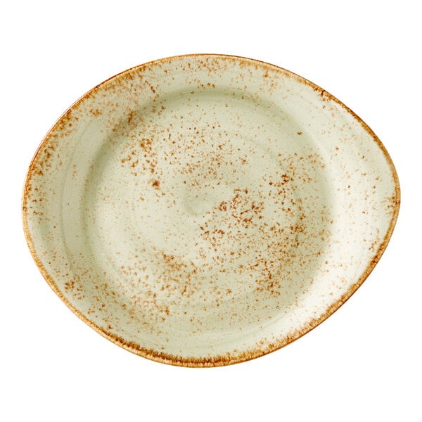 A green, oval-shaped ceramic plate with a speckled pattern and rustic brown edges.