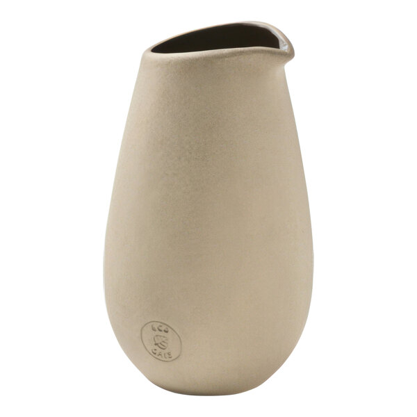 A beige vase with a black top and a handle.