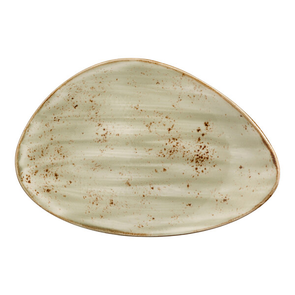 A white oval plate with green and brown speckles.