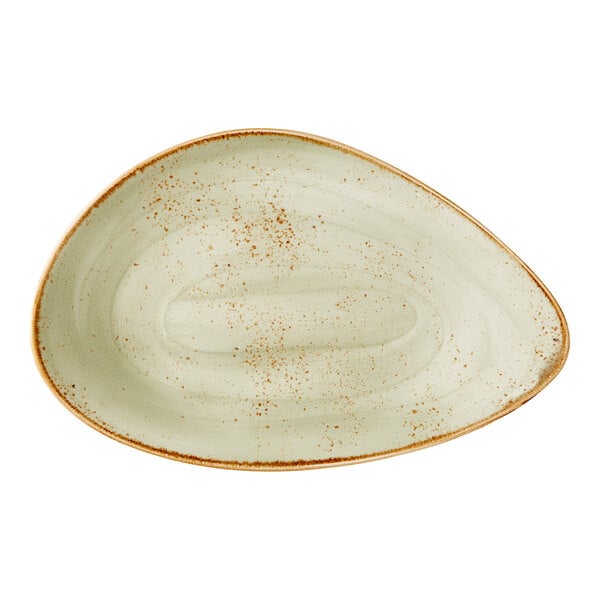 A large, green, oval-shaped freestyle plate with a speckled design and rustic brown rim.