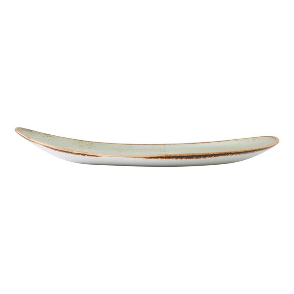 A large, oval-shaped green ceramic plate with slightly raised edges and a rustic finish.