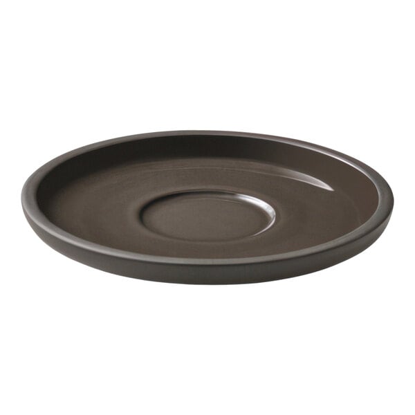 A taupe Playground ReNew saucer with a rim on a table.
