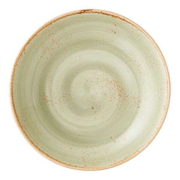 A round, green ceramic coupe bowl with a rustic, speckled finish and a slightly raised rim.