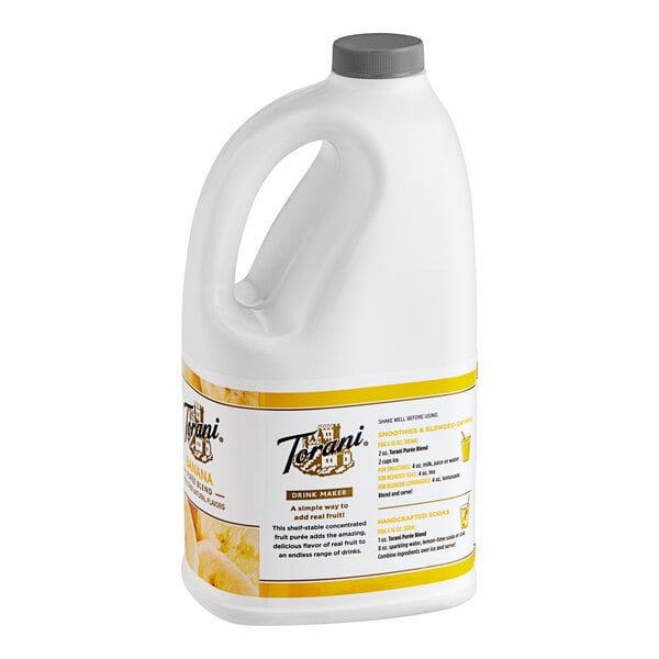 A white jug with a yellow label of Torani Banana Puree Blend.