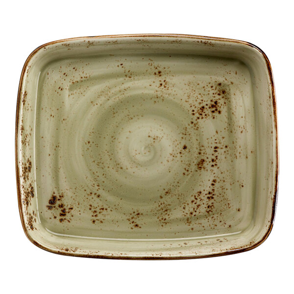 A square ceramic dish with brown speckles and a spiral pattern.