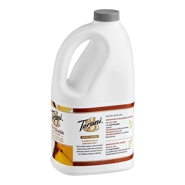 A white jug of Torani Pina Colada Puree Blend with a handle.