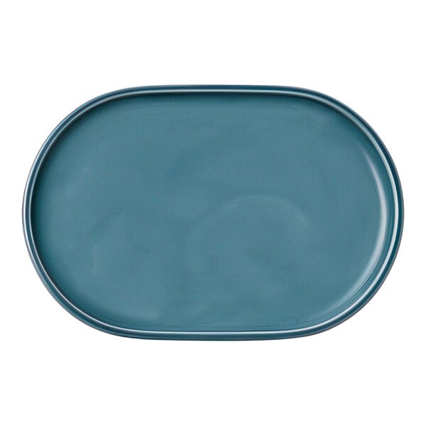 A Schonwald Petrol Blue oval platter with a white border.