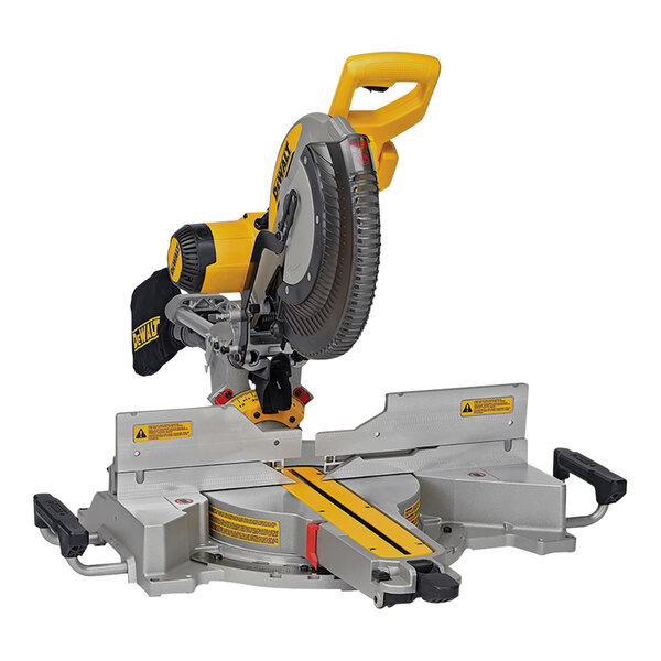 A DeWalt 12" double bevel sliding compound miter saw with a yellow handle on a table.