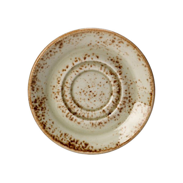 A close-up of a Steelite Performance Craft green and brown speckled double well saucer.