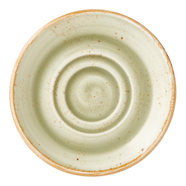 A round, green double well saucer with a rustic, speckled finish and a slightly raised rim.