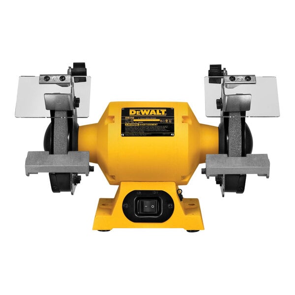 A yellow and black DeWalt bench grinder kit with a black label.