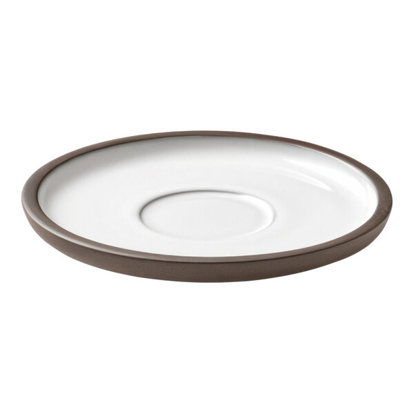 A white Playground ReNew saucer with a brown rim.