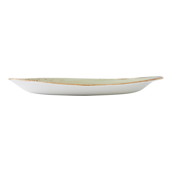 A green, oval-shaped freestyle plate with a slightly raised rim and rustic edge.