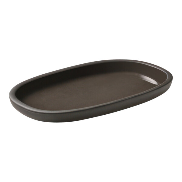 A taupe rectangular oval Playground ReNew Eco-Gres platter on a counter.