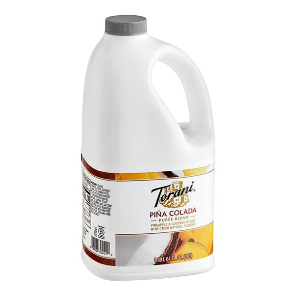 A white jug of Torani Pina Colada Puree Blend.