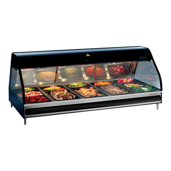 An Alto-Shaam countertop heated display case with food inside.