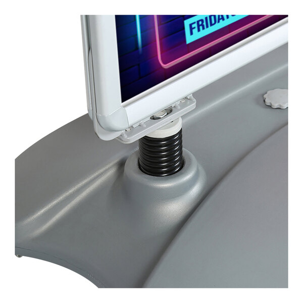 A close-up of a silver double-sided aluminum sign with a snap frame mounted on a gray plastic base.