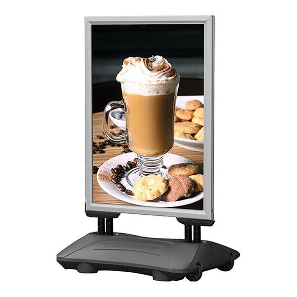 A United Visual Products silver double-sided sign advertising coffee and cookies on a stand.