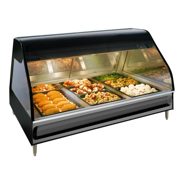 An Alto-Shaam stainless steel countertop heated display case with food inside.