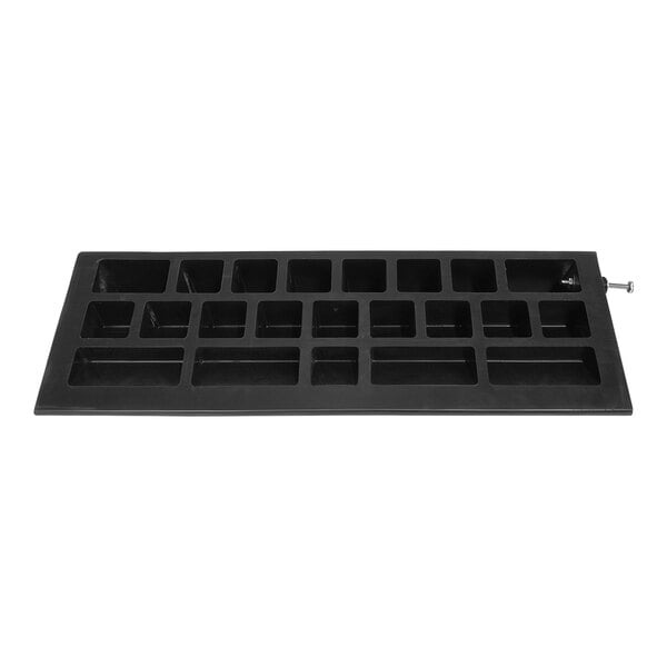 A black rectangular rubber ramp with square holes.