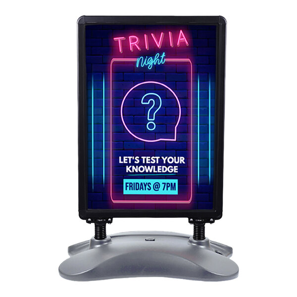 A double-sided black aluminum sign with a snap frame and plastic base, displaying a trivia night event poster.