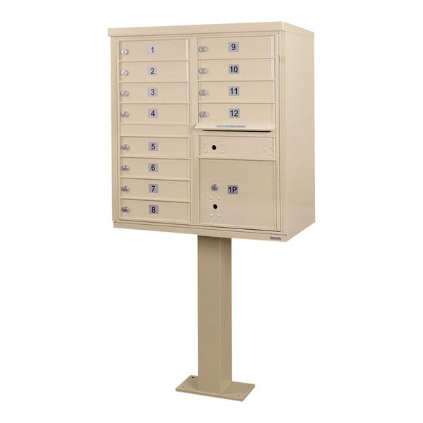 A sandstone United Visual Products pedestal cluster mailbox with 12 doors.