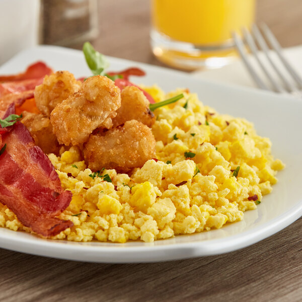 A plate of Papetti's fully cooked scrambled eggs and bacon.