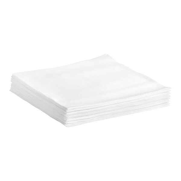 A stack of Tork white flat pack dinner napkins.
