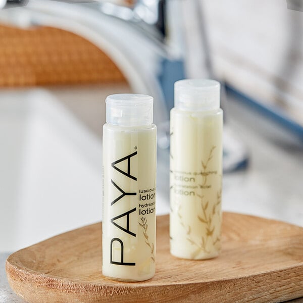 A white PAYA lotion bottle with black text.