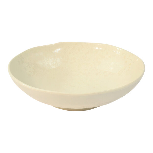 An ivory bowl with a speckled surface.