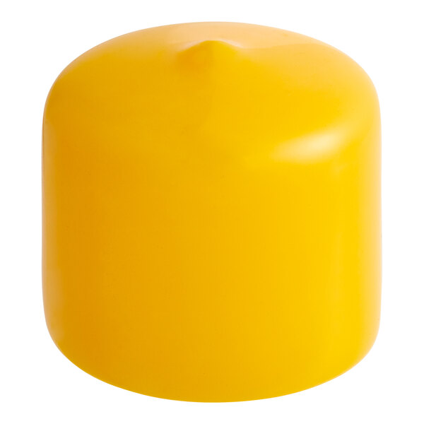 A close up of a yellow cylindrical object with a pointy tip.