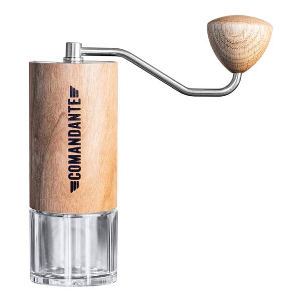 A wooden and glass Comandante C40 coffee grinder.