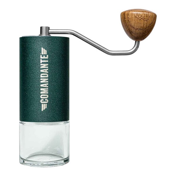 A green and white Comandante coffee grinder with a wooden handle.
