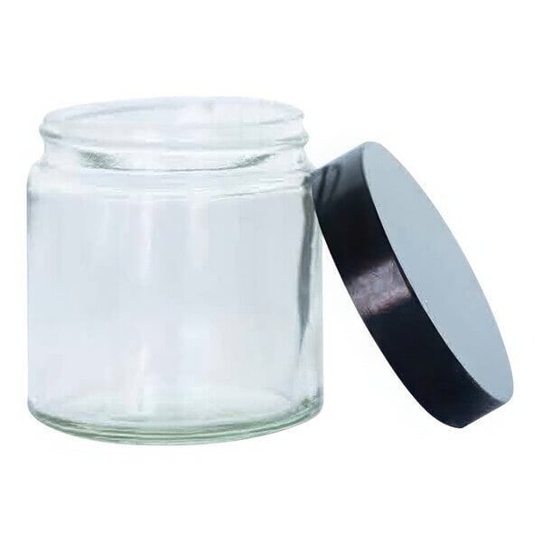 A clear glass jar with a black lid.