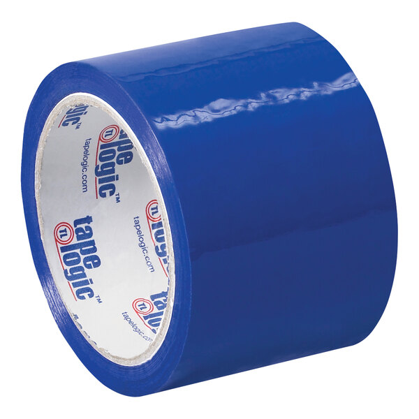 A close-up of a roll of Tape Logic blue carton sealing tape with white writing on it.