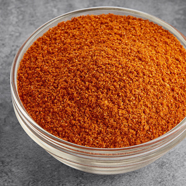 A bowl of orange Hometown Provisions Taco Seasoning.