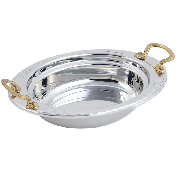 A silver Bon Chef oval food pan with round brass handles.