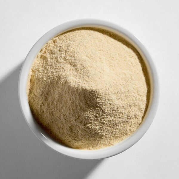 A white bowl filled with a light beige, finely ground powder.