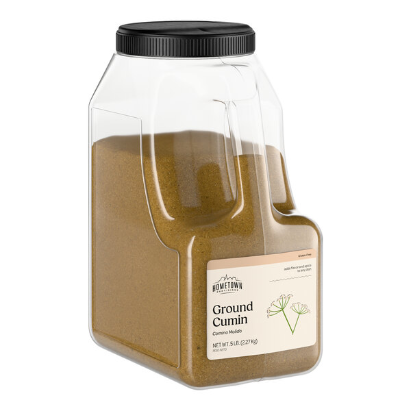 A large plastic container of Hometown Provisions ground cumin.