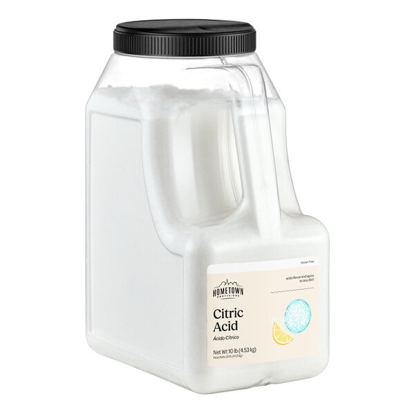 A large clear plastic container with a black screw-on lid, filled with a white powder labeled as citric acid.