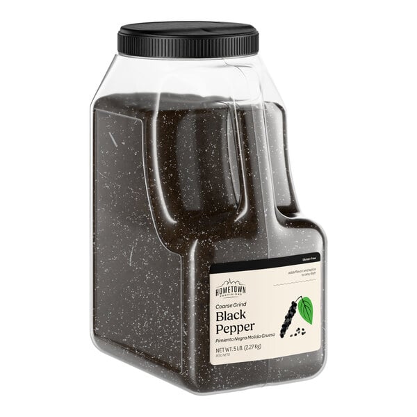 A large plastic container of Hometown Provisions coarse grind black pepper.