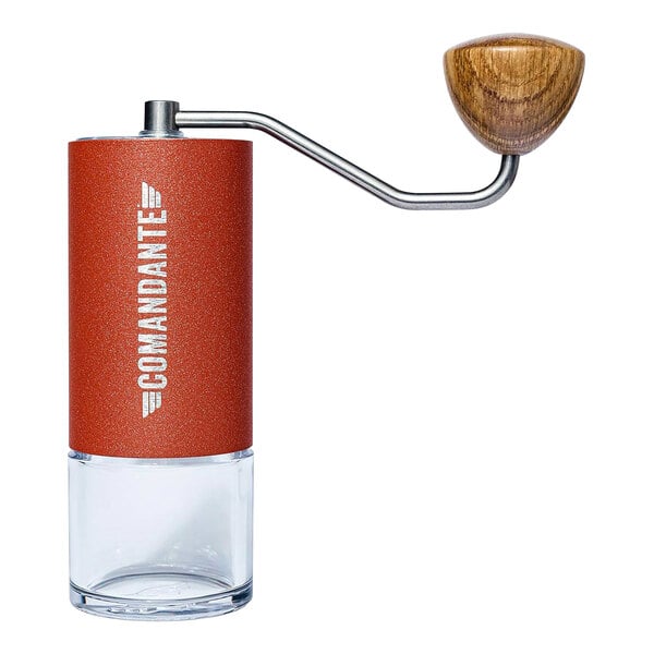 A Comandante coffee grinder with a wooden handle on a table.