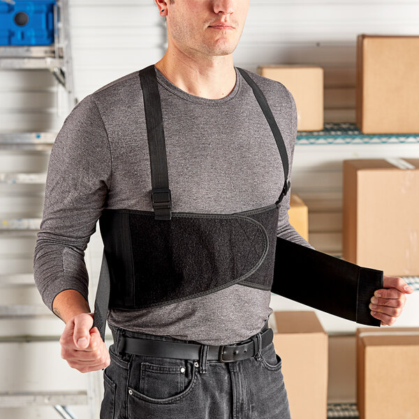 A man wearing a Lavex black back support belt.