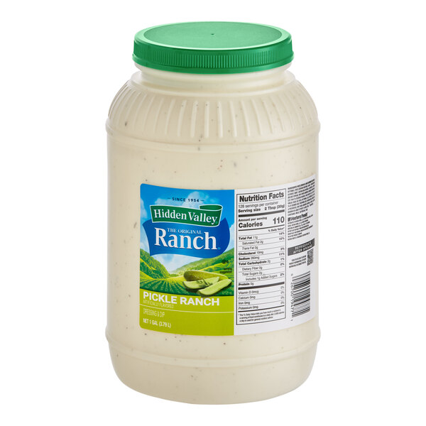 A white jar of Hidden Valley Pickle Ranch Dressing with a green lid.