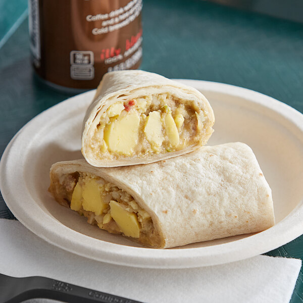 A Green Chile Fiesta Breakfast Burrito on a plate.