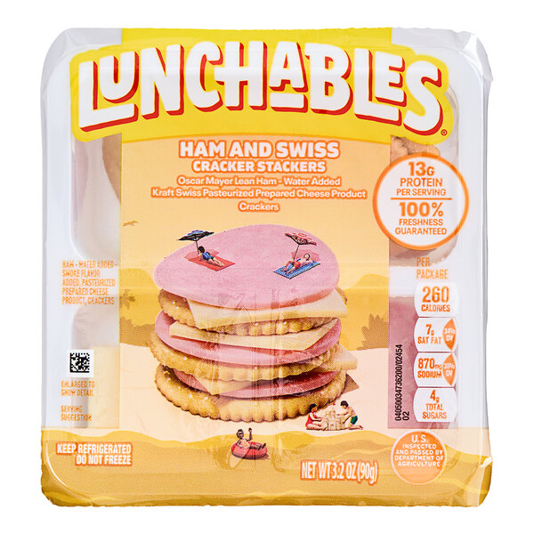A package of Lunchables Ham and Swiss cracker stackers with a sandwich inside.