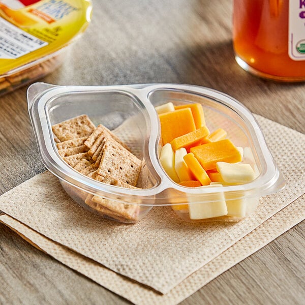 A plastic container with Wheat Thins, Monterey Jack and Mild Cheddar cheese.