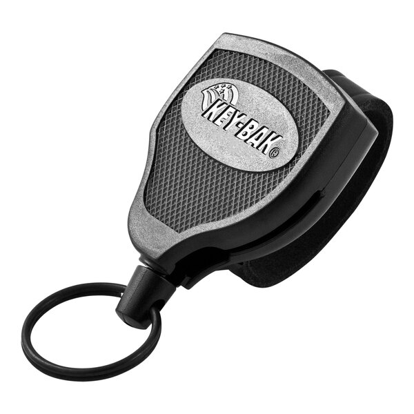 A black KEY-BAK Super48 Plus keychain with a silver logo on the front.