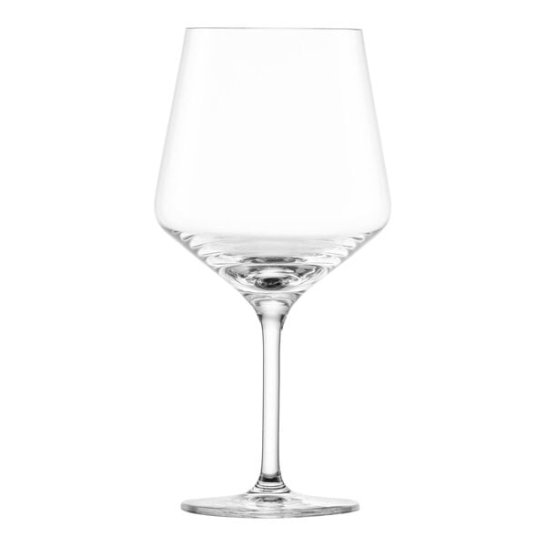 A close-up of a clear Schott Zwiesel wine glass with a stem.