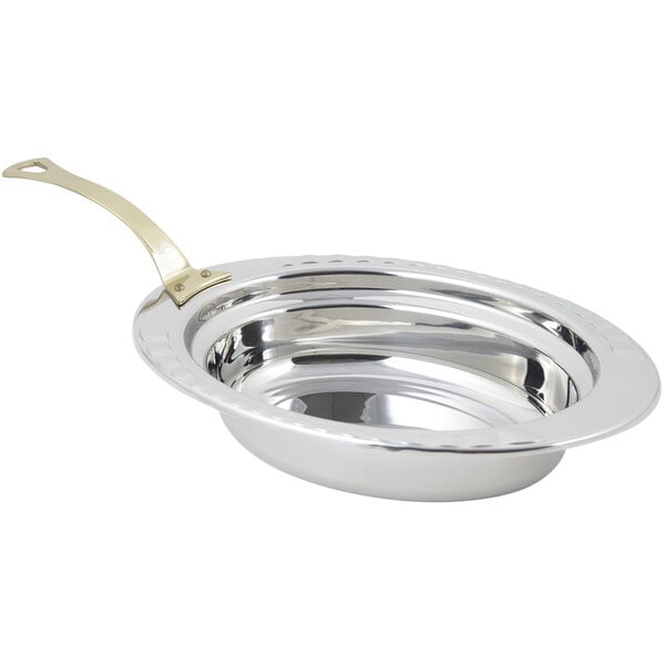 A silver stainless steel Bon Chef oval food pan with a long brass handle.